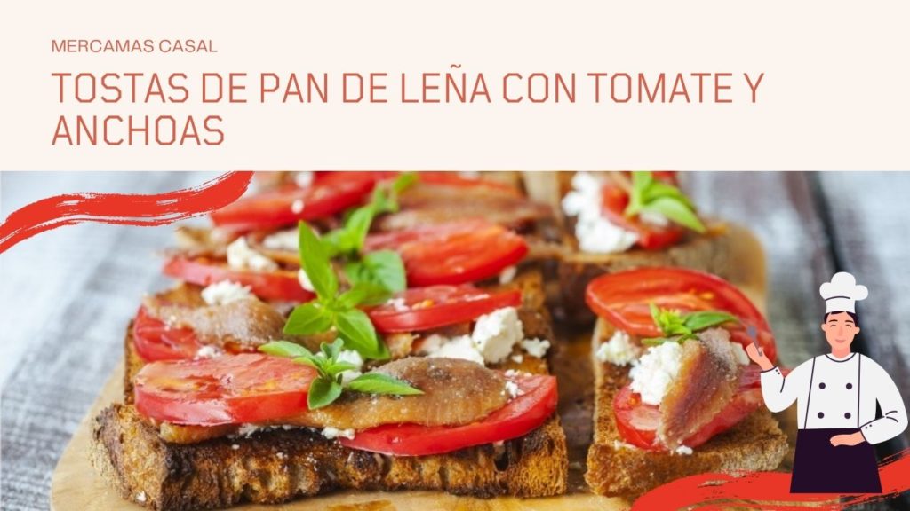 Tostas de pan de leña con tomate y anchoas